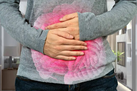 photo of hands holding sore stomach concept
